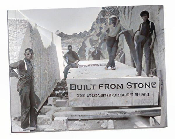 four people standing on a large slab of stone