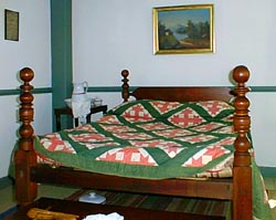 a bed with a quilt on it